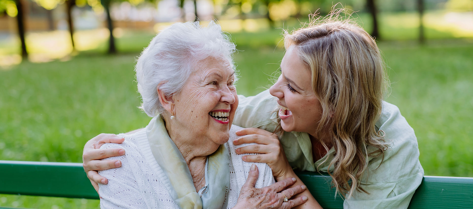 Senior and caregiver sharing a joyful moment