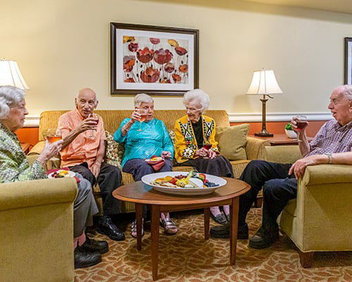Seniors socializing in a community lounge