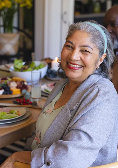 Smiling senior enjoying community dining